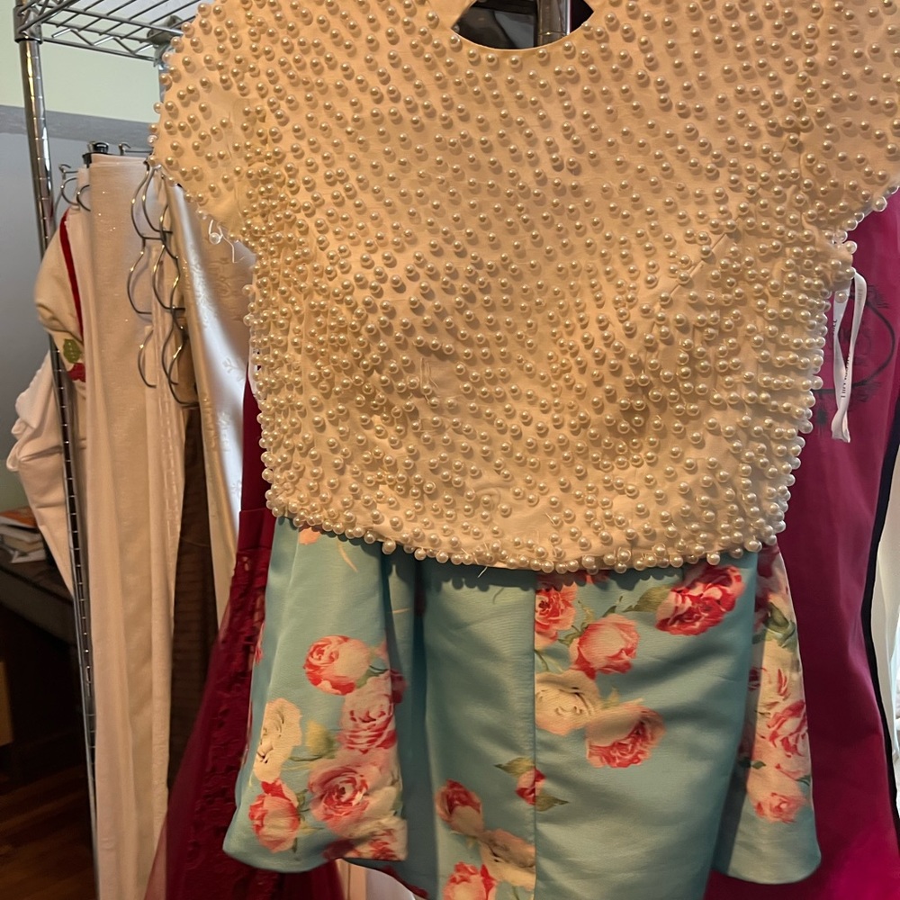 This is a two piece Sherri hill skirt and top.